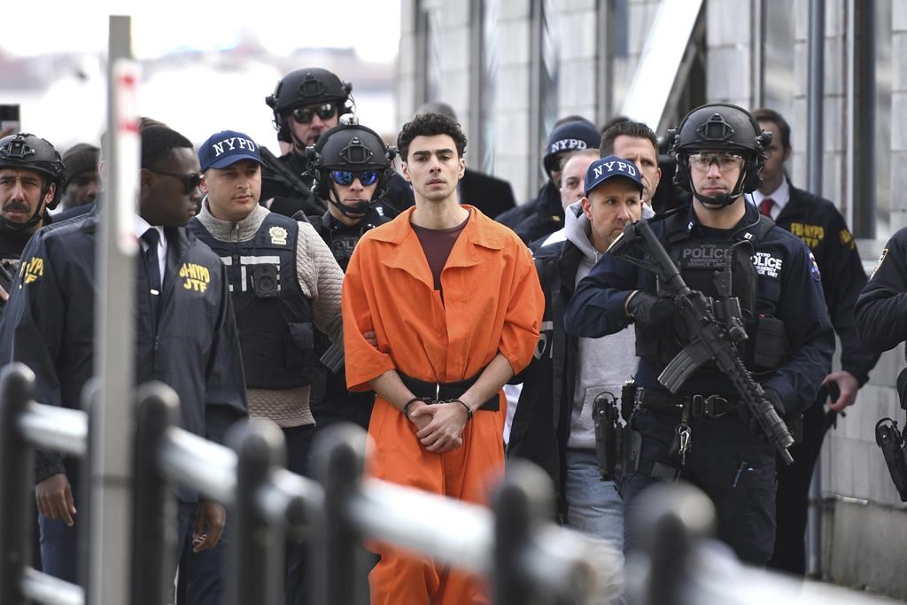 Luigi Mangione, a suspect in the fatal shooting of UnitedHealthcare CEO Brian Thompson, is escorted by police, Thursday, Dec. 19, 2024, in New York.