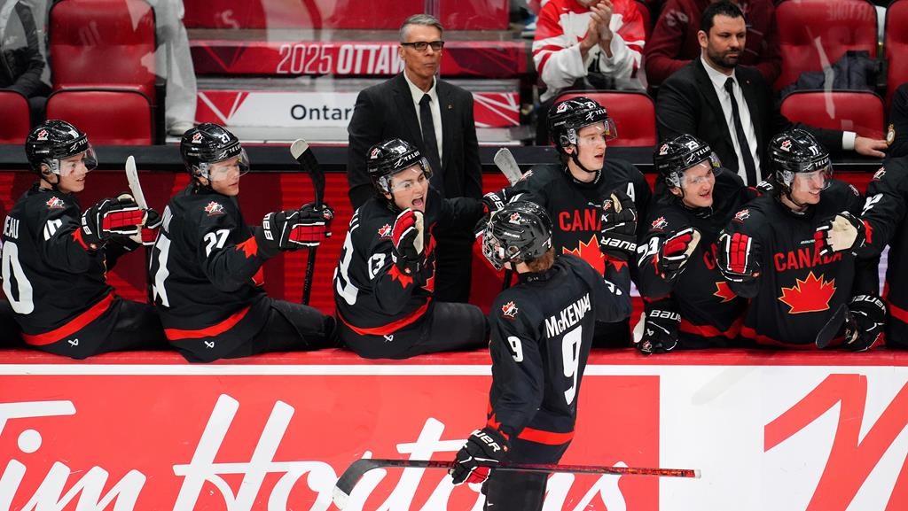 Canada's Gavin McKenna (9) celebrates with the bench after his game-winning goal during third period World Junior Championship hockey pre-tournament action against Czechia, in Ottawa, Monday, Dec. 23, 2024.