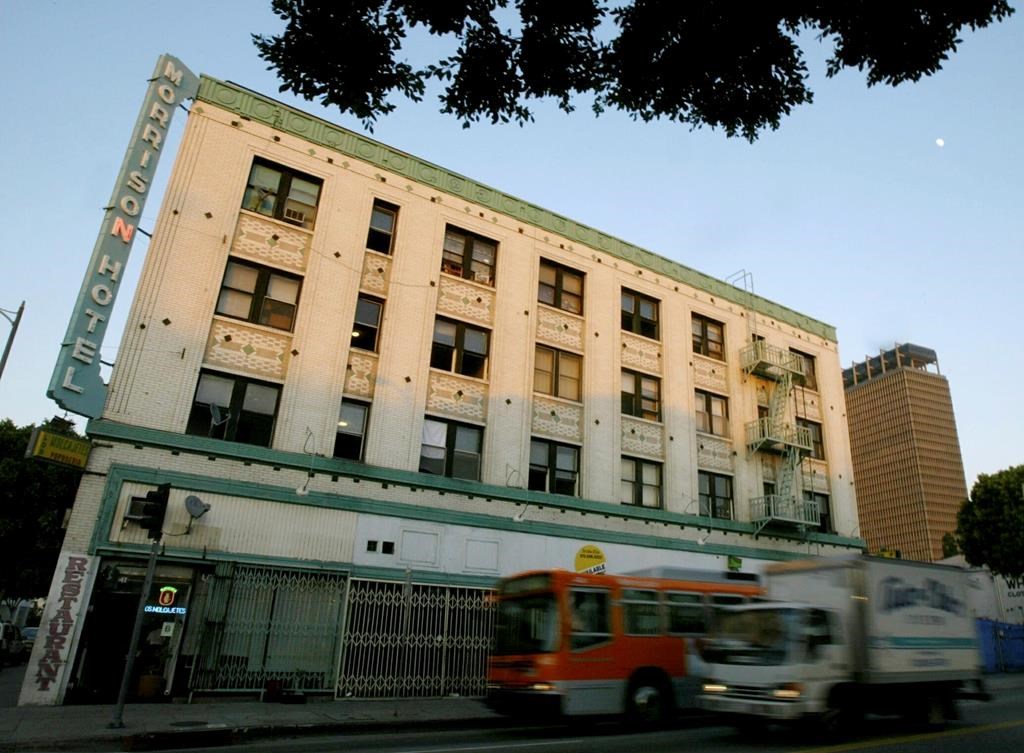 FILE - Vehicles drive past the Morrison Hotel on Tuesday, Dec. 21, 2004, in Los Angeles.