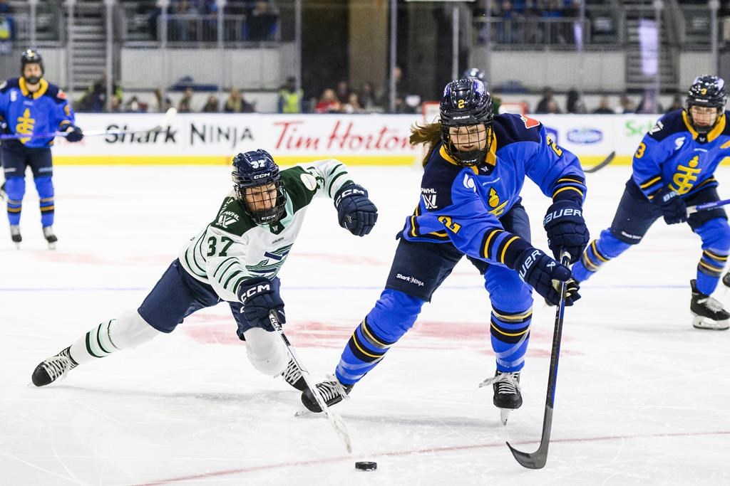 Toronto Sceptres' Jessica Kondas (2) races for the puck with Boston Fleet's Theresa Schafzahl (37) during first period PWHL hockey action in Toronto on Friday, December 27, 2024.