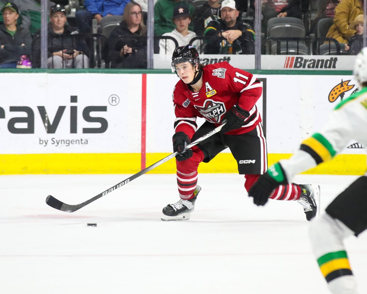 Defenceman Cam Allen brings the puck across the London Knights blue line.