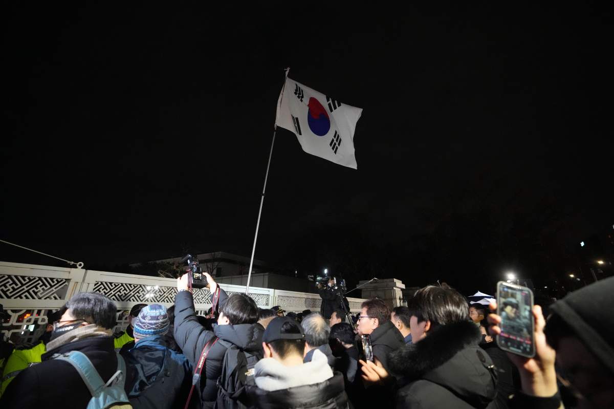 People try to enter the National Assembly in Seoul, South Korea, Tuesday, Dec. 3, 2024. (AP Photo/Lee Jin-man)