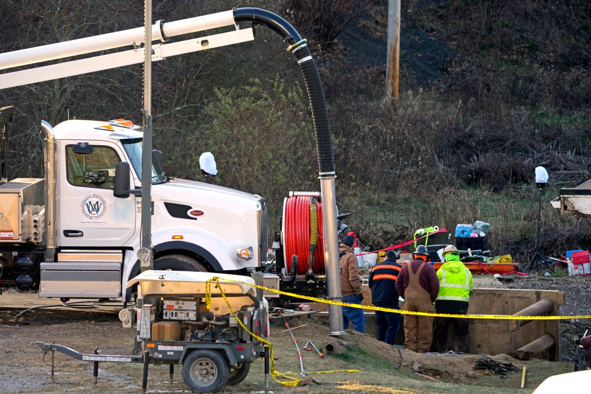 Rescue workers continue to search, Wednesday, Dec. 4, 2024, for Elizabeth Pollard, who is believed to have disappeared in a sinkhole while looking for her cat, in Marguerite, Pa.