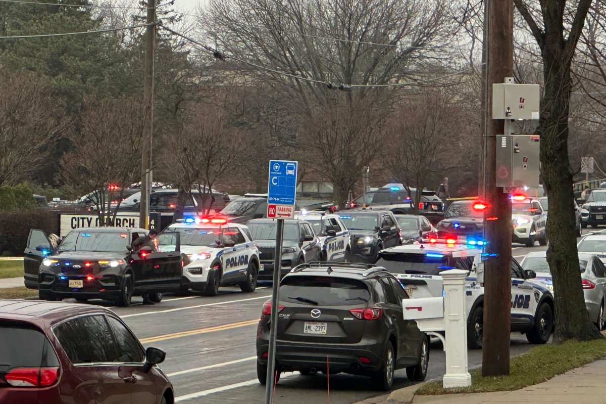 Emergency vehicles are parked outside the Abundant Life Christian School in Madison, Wis., where multiple injuries were reported following a shooting, Monday, Dec. 16, 2024.