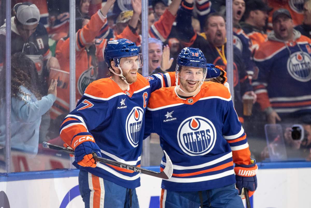 Edmonton Oilers' Connor McDavid (97) and Zach Hyman (18) celebrate a goal against the St. Louis Blues during second period NHL action in Edmonton on Saturday, December 7, 2024.