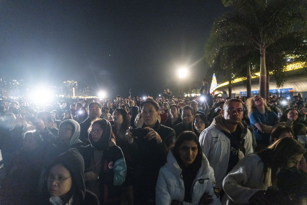 People watch the panda-themed drone show at the waterfront of the Victoria Harbour in Hong Kong, Saturday, Dec. 28, 2024.