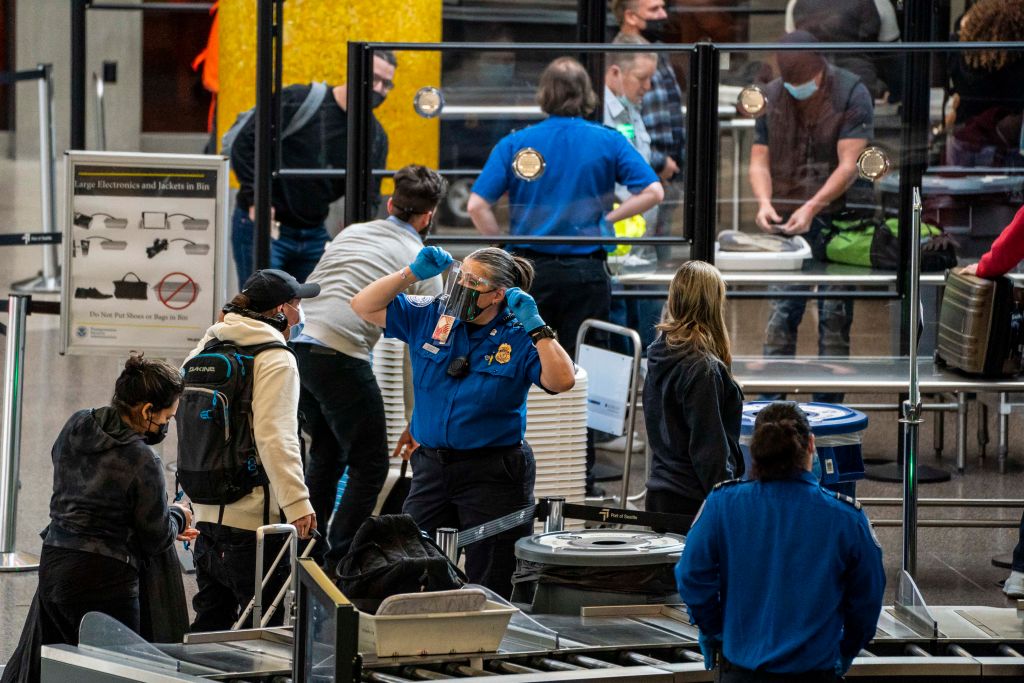 Travellers pass through security screening at Seattle-Tacoma International Airport on November 29, 2020 in SeaTac, Washington.