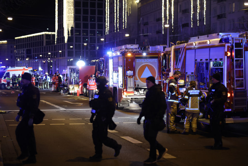 Police and ambulances work next to the Christmas market, where a car crashed into a crowd injuring dozens, according to a spokesman for the local rescue service, on December 20, 2024 in Magdeburg, eastern Germany. According to the emergency service, several people were "severely" injured", the spokesman said. The death toll in Magdeburg market attack rose to two according to the State Premier.