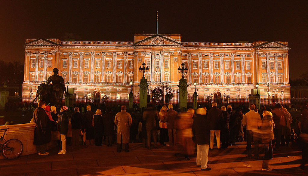 Buckingham Palace is lit up with artwork around the holiday season.