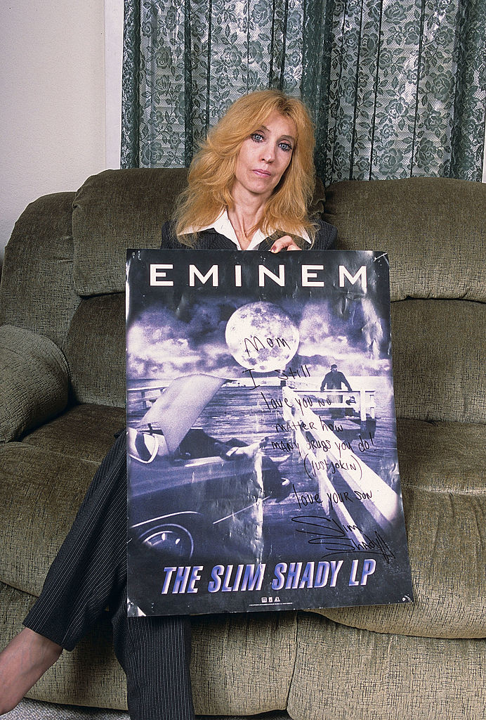 Eminem's mother, Debbie Nelson, holds a poster with a hand written message during a portrait session at her home in September, 2005 in Detroit, Michigan.