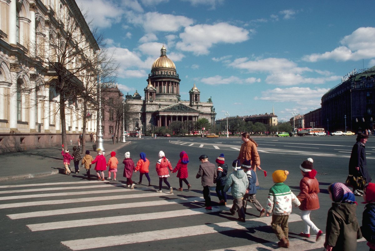 Children cross the street near the golden-domed St. Isaac's Cathedral in Leningrad.