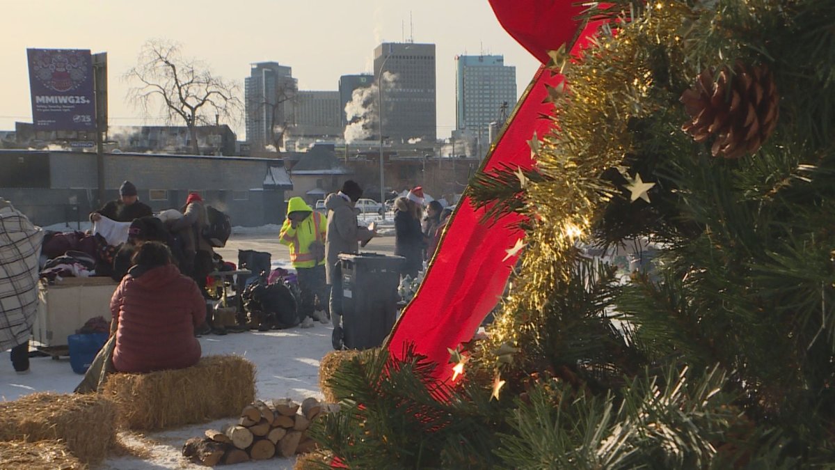 People gather outside N’Dinawemak on Dec. 20, 2024 for a holiday gathering and donation drive.