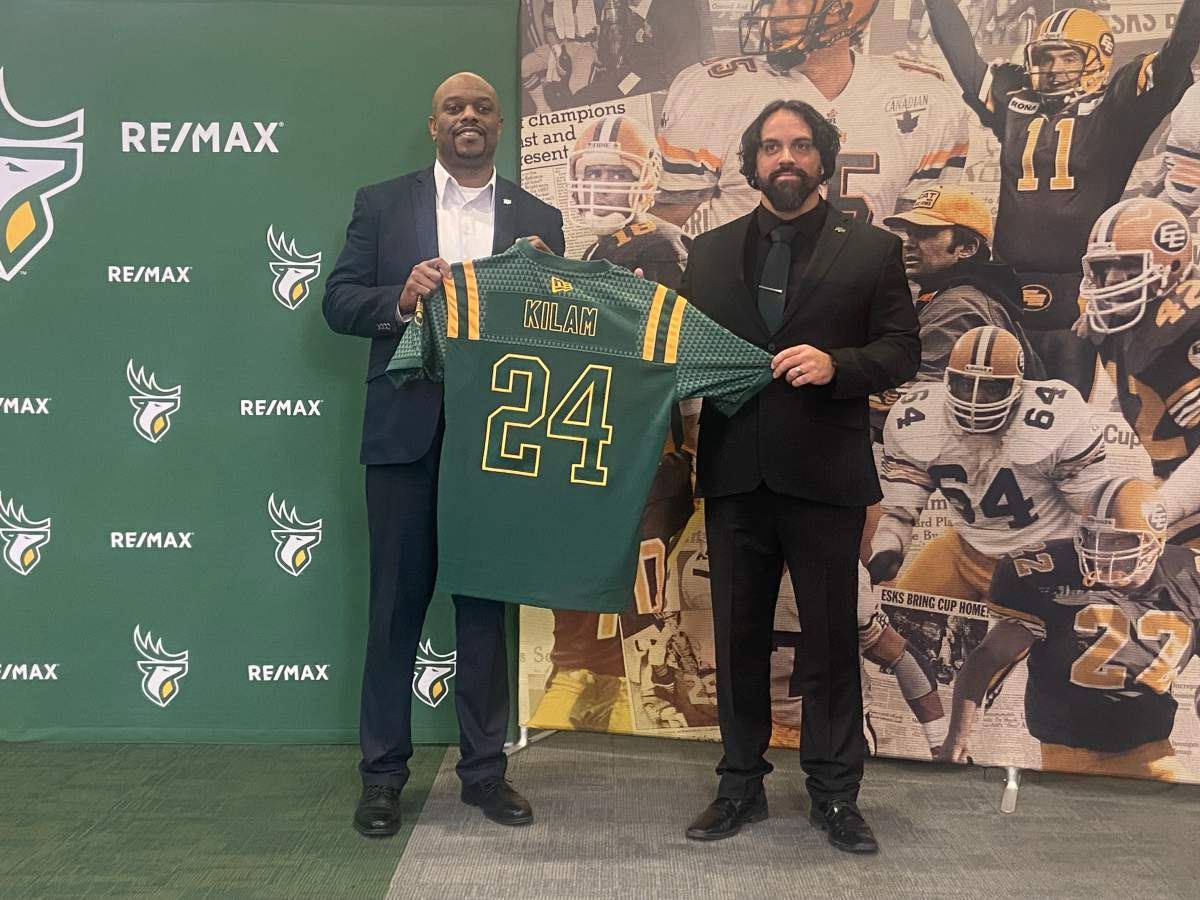Edmonton Elks' GM Ed Hervey poses for a photo with Mark Kilam on Dec. 2, 2024 shortly after announcing that Kilam will be the CFL club's new head coach.