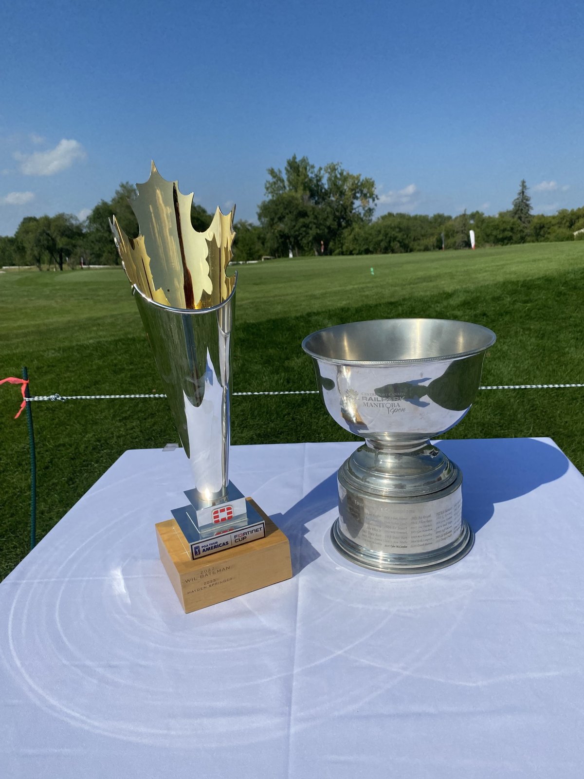 The PGA Tour Americas Fortinet Cup and CentrePort Canada Rail Park Manitoba Open Trophy on display at the 2024 Tournament hosted by Southwood Golf and Country Club.