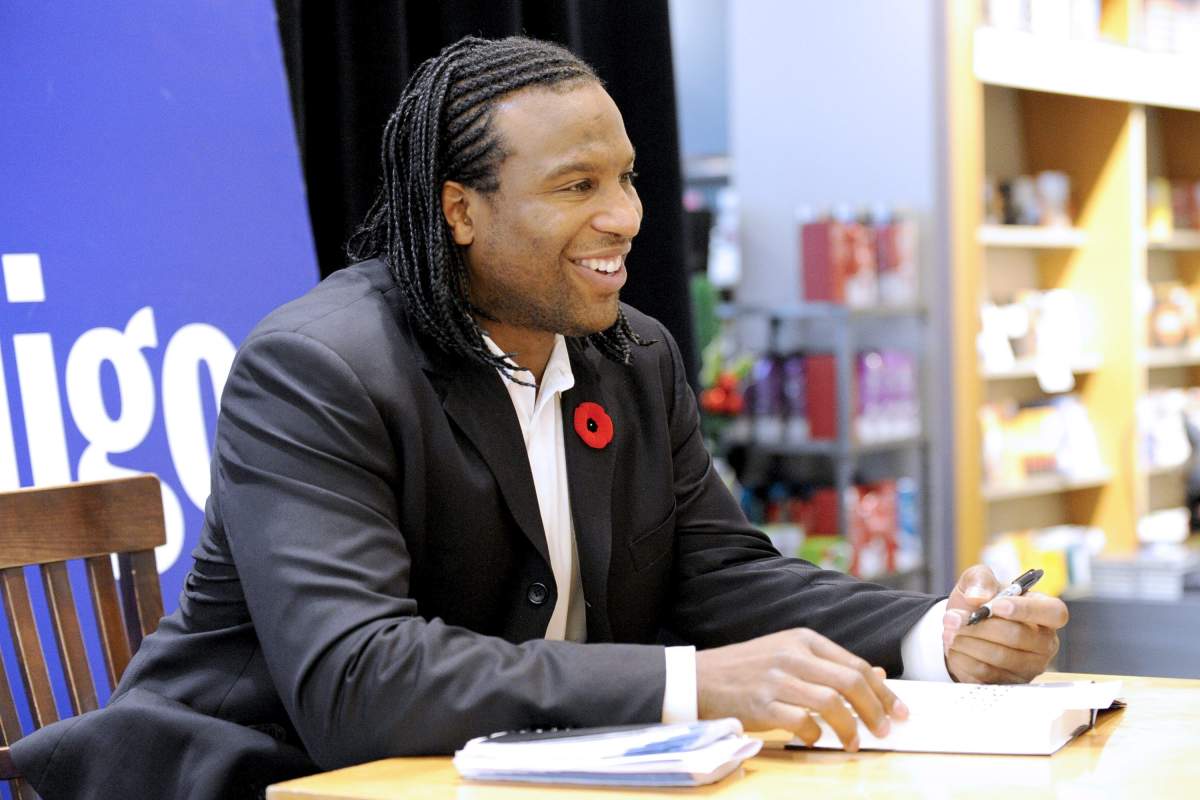 Former NHL player Georges Laraque appears at Toronto Eaton Centre's Indigo Bookstore on November 9, 2011, meeting fans and signing autographs in promoting his latest book.