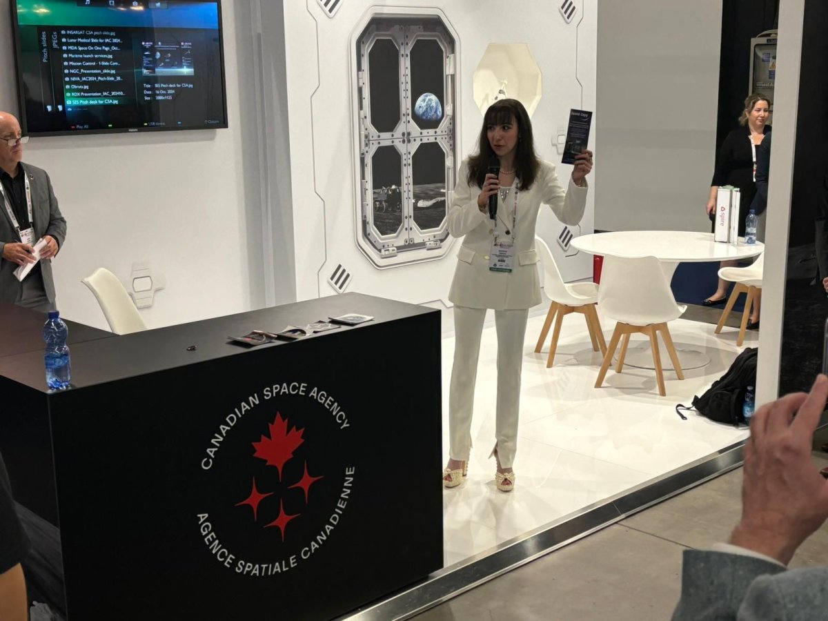 Madison Feehan presents Space Copy during the 75th International Astronautical Congress in Milan at the Canadian Space Agency Pavillion.