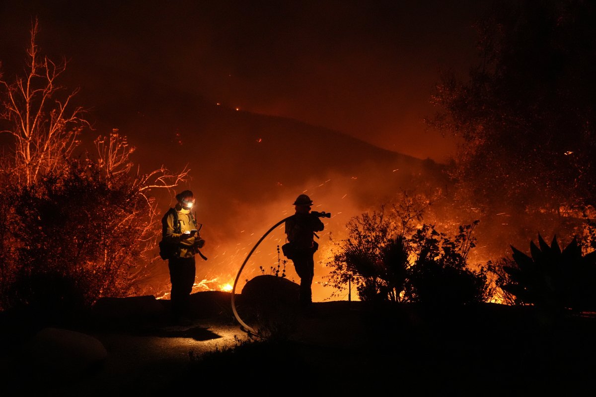 Firefighters battle the Franklin Fire in Malibu, Calif., Tuesday, Dec. 10, 2024.