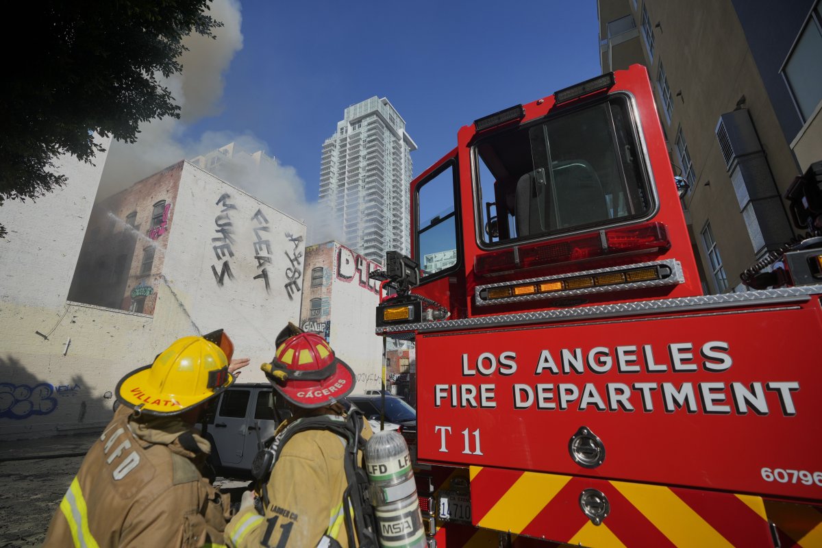 Fire crews battle a building fire on the 1200 block of South Hope Street Thursday, Dec. 26, 2024, in Los Angeles.