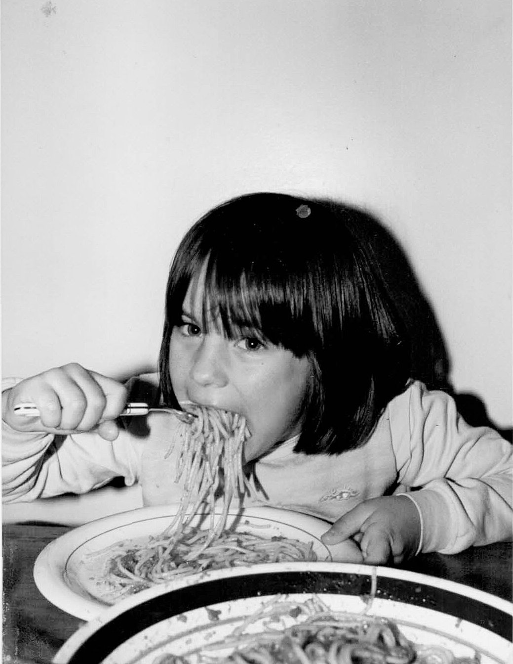 Elisa Zenari enjoying a plate of pasta.
