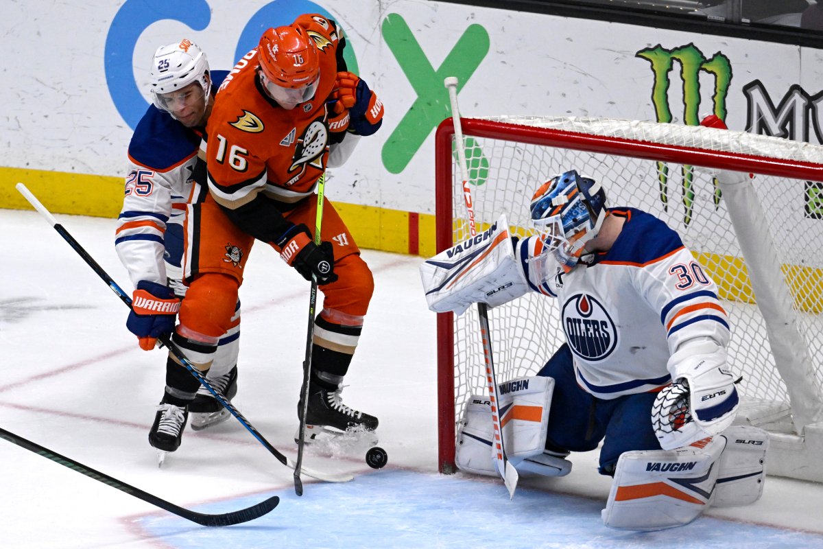 Anaheim Ducks center Ryan Strome (16) shoots to score against Edmonton Oilers goaltender Calvin Pickard (30) and defenseman Darnell Nurse (25) during the third period of an NHL hockey game in Anaheim, Calif., Sunday, Dec. 29, 2024.