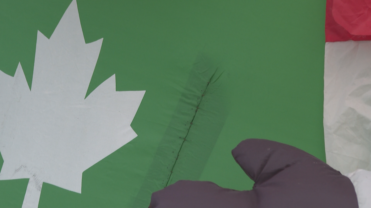 An inflatable shown sewn up after it was cut with a knife.