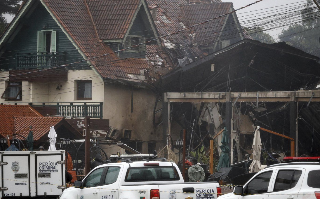 Police cordon off houses that were hit by a plane in Gramado, Rio Grande do Sul state, Brazil.