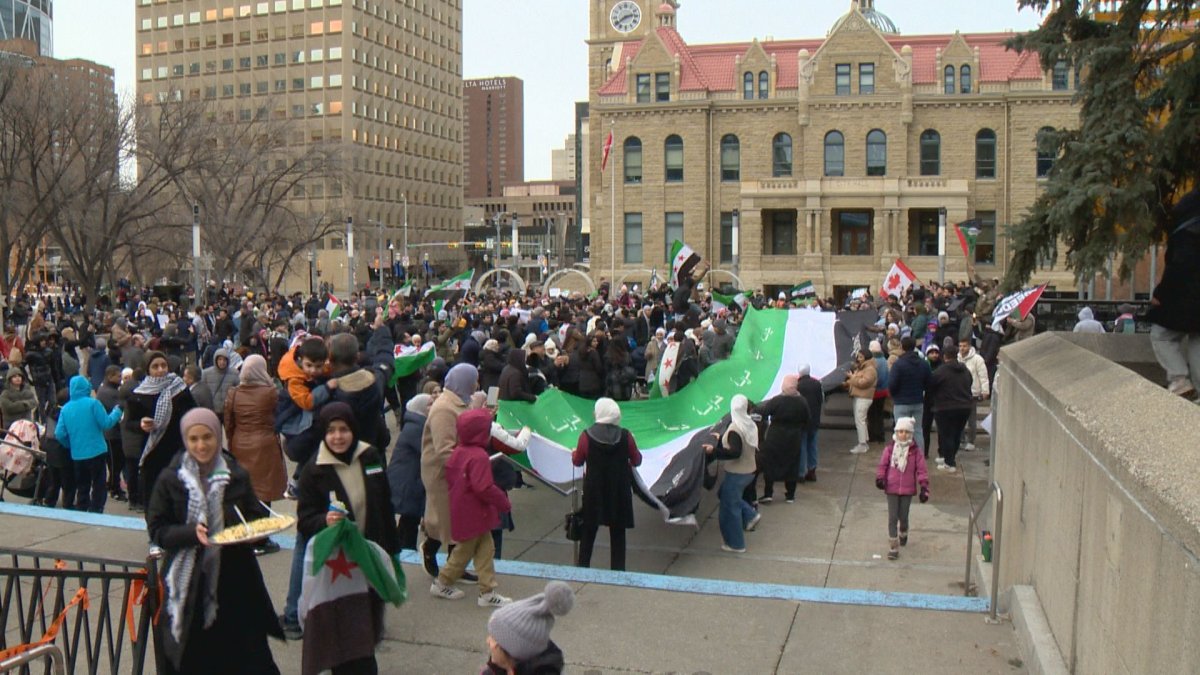 Hundreds gather out front of Calgary City Hall