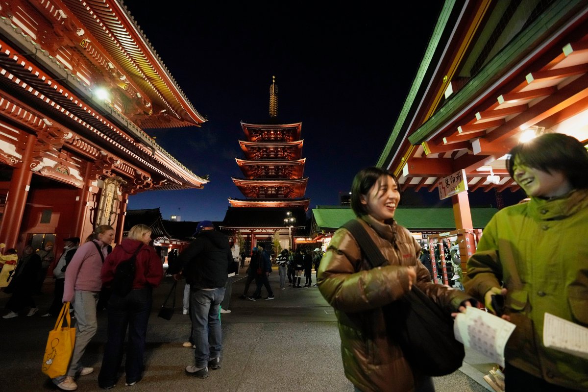 People visit Sensoji Buddhist temple on New Year’s Eve in Tokyo, Tuesday, Dec. 31, 2024. (AP Photo/Hiro Komae)