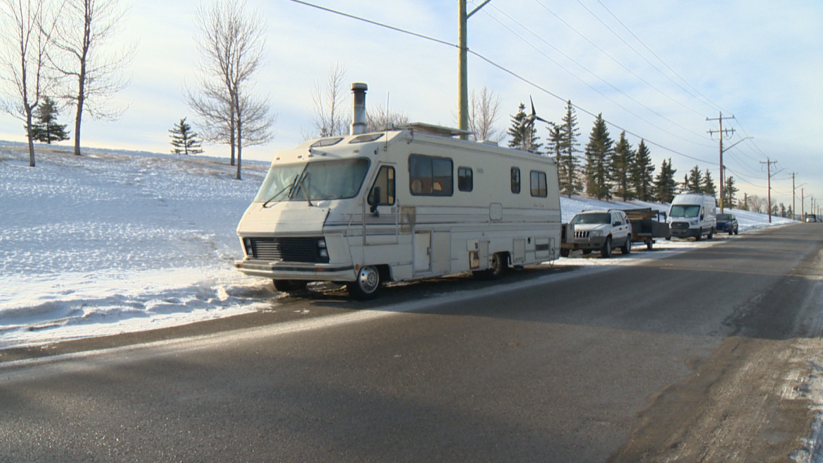 An RV parked on the side of the road.