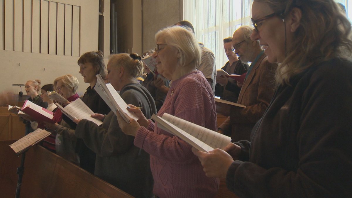 A church choir in Winnipeg sings in preparation for Christmas.