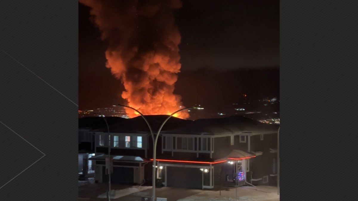 A huge fire lit up the night sky around Cochrane, Alta, Wednesday evening as two homes under construction in the Rivercrest neighbourhood were destroyed by the blaze.