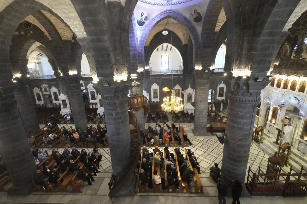 Syrian attend the first Sunday Mass since Syrian President Bashar Assad's ouster, at Mariamiya Orthodox Church in old Damascus, Syria, Sunday, Dec. 15, 2024. (AP Photo/Hussein Malla) Hussein Malla