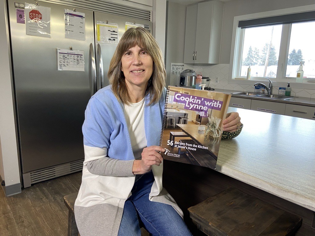 Lynne Rosychuk holds the "Cookin' With Lynne' book, for sale by the Jessica Martel Memorial Foundation.