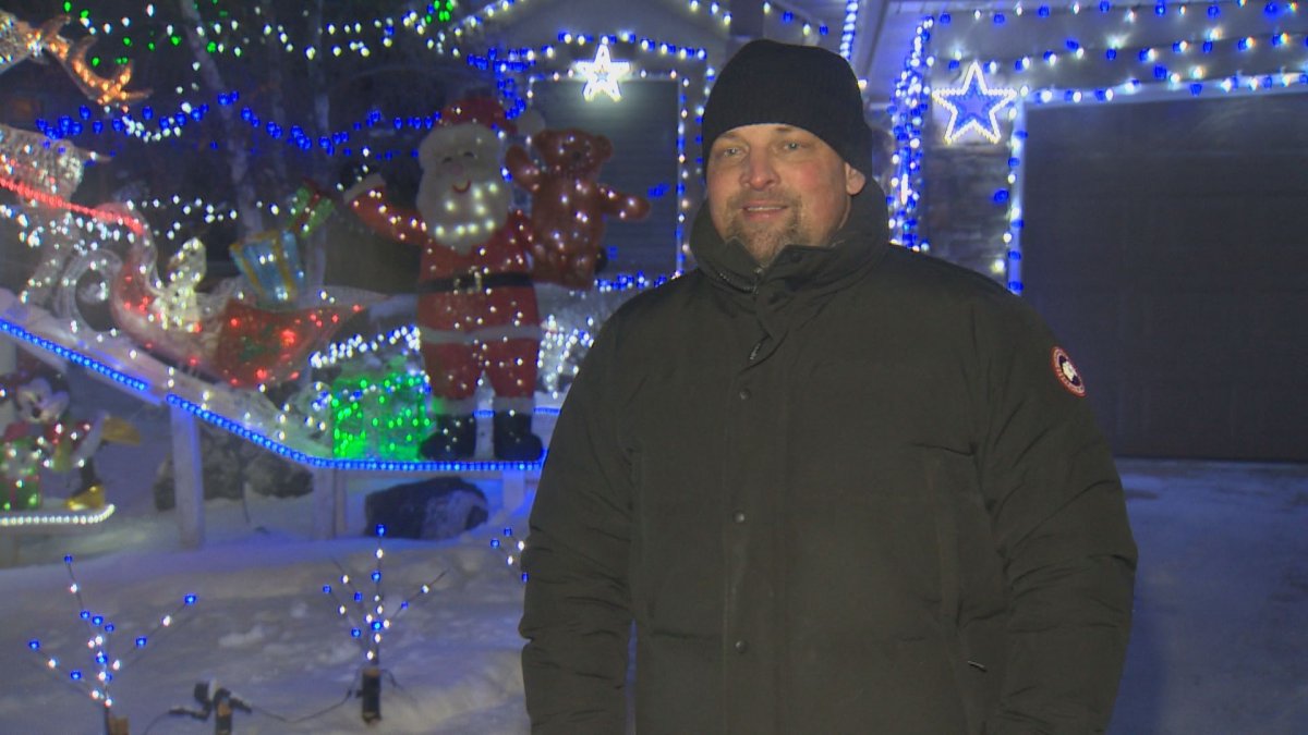 Ken Gallant stands in front of his home in Winnipeg.