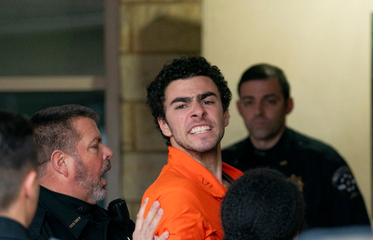 Suspect Luigi Mangione is taken into the Blair County Courthouse on Tuesday, Dec. 10, 2024, in Hollidaysburg, Pa.