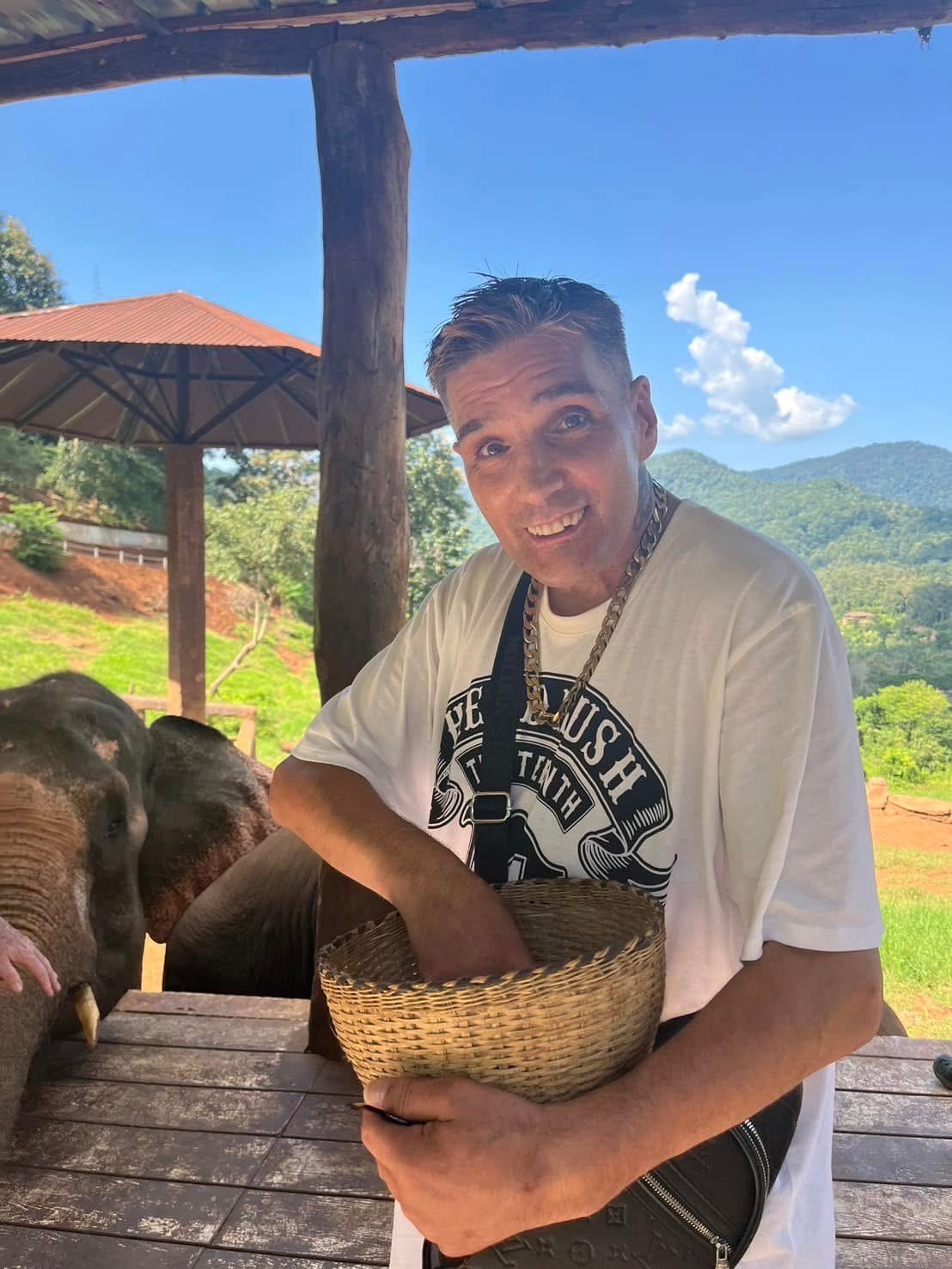 Smokey is seen with an elephant in Thailand.