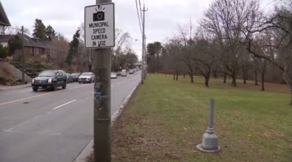 Toronto speed camera chopped down again and thrown into pond