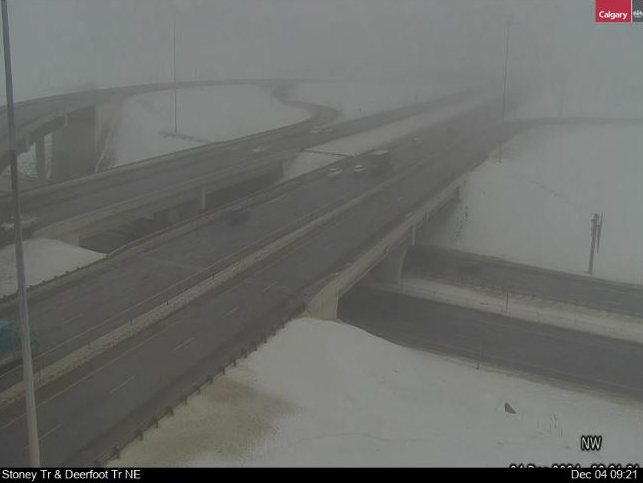 Traffic cameras in and around Calgary, such as this one at Stoney Trail and Deerfoot Trail NE show areas of thick fog, Global Calgary traffic reporter Leslie Horton advises motorists to make sure your vehicle's headlights are turned on.