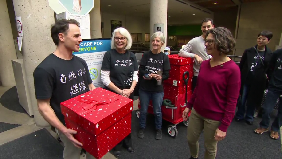 BC Transplant volunteers deliver a thank-you gift of popcorn to health-care workers at Vancouver General Hospital.