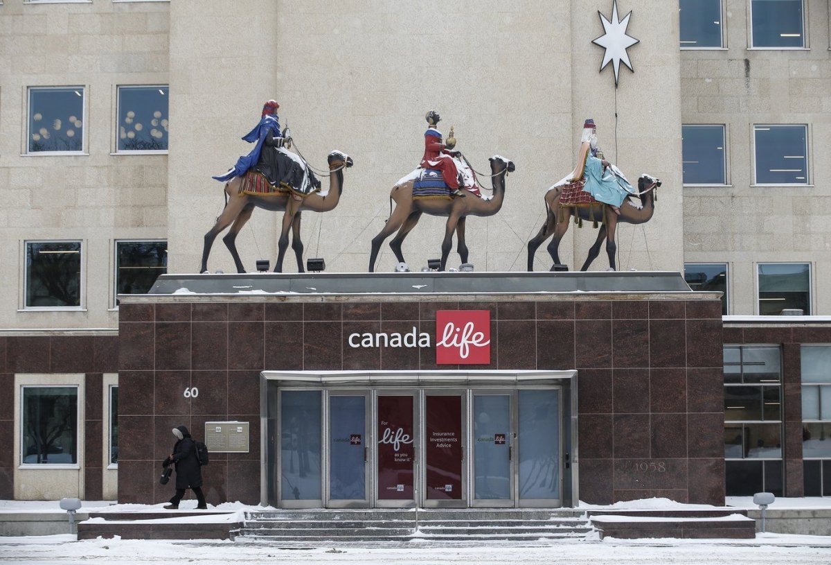 Three Wise Men statues stand on the entrance of the Canada Life headquarters in Winnipeg, Man. Tuesday, Dec. 3, 2024. For the past 50 years the Canada Life Building, formerly the Great West Life Building, has displayed the three four-metre-tall wise men statues to mark the Christmas season.