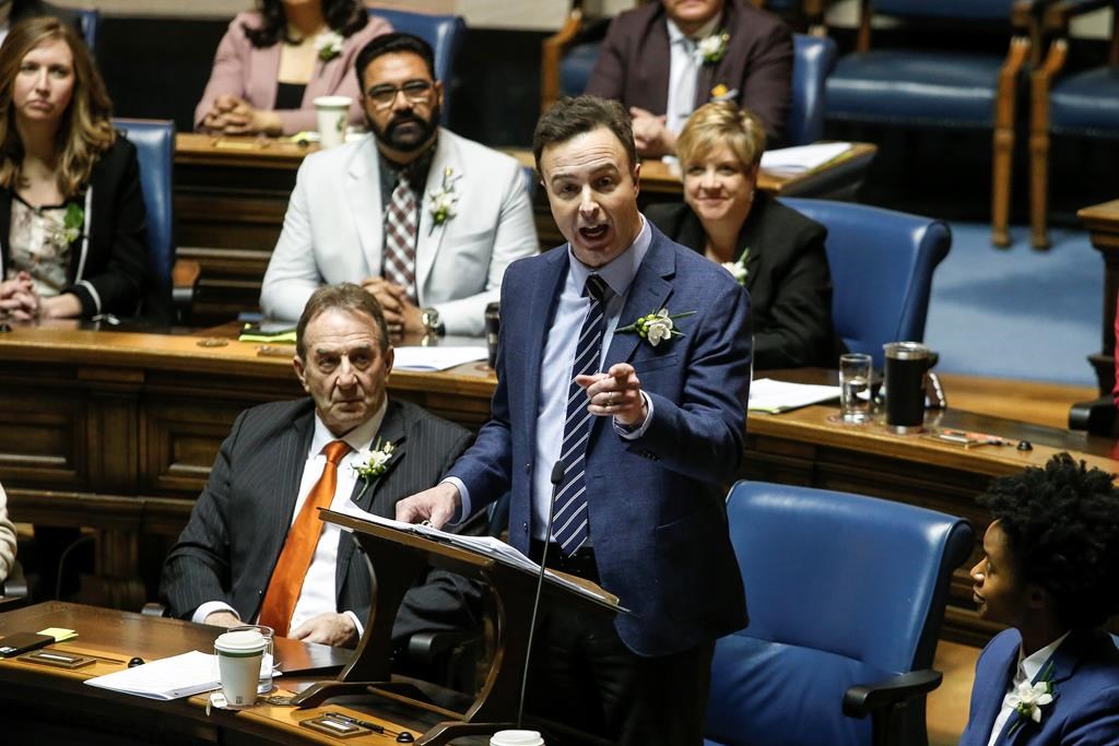 Manitoba Finance Minister Adrien Sala delivers the provincial budget in the Manitoba Legislature in Winnipeg, Tuesday, April 2, 2024. The Manitoba government and officials at Manitoba Hydro say it's too early to discuss the potential fallout from tariffs threatened by incoming U.S. President Donald Trump. THE CANADIAN PRESS/John Woods.