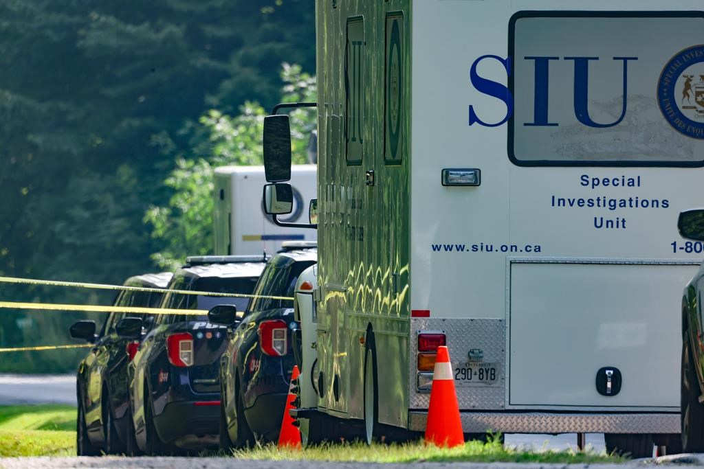 Vehicles from the provincial Special Investigations Unit (SIU) are shown in Innisfil, Ontario on Friday Aug. 16, 2024. THE CANADIAN PRESS/Christopher Drost.