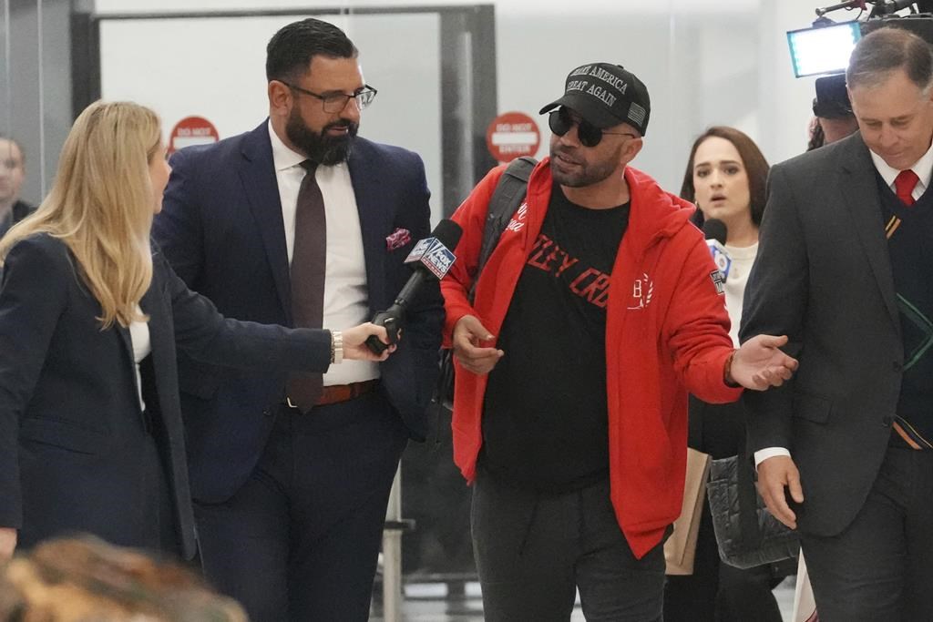 Recently pardoned by President Donald Trump after he was convicted of seditious conspiracy for his role in the January 6 attack on the U.S. Capitol, Enrique Tarrio answers questions after he arrived at Miami International Airport, Wednesday, Jan. 22, 2025, in Miami.