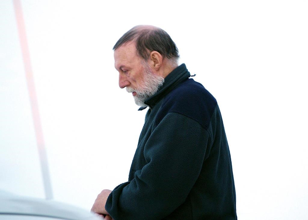 Eric Dejaeger leaves an Iqaluit courtroom on Jan. 20, 2011. A Nunavut judge is hearing sentencing arguments for Dejaeger, a former Catholic priest who pleaded guilty to sexually abusing several Inuit children decades ago.