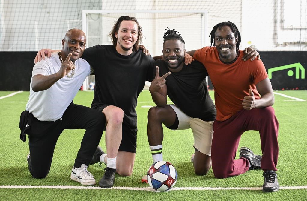 Jean-Philippe Dure, from left, Samuel Drolet-Begin, Joseph Tiedjou and Fabrice Mugabe pose for a photograph during a training session with the Canadian Street Soccer Association in Montreal, Wednesday, Jan. 22, 2025, with the hope of taking part in the Homeless World Cup which takes place in Norway later this year. THE CANADIAN PRESS/Graham Hughes.
