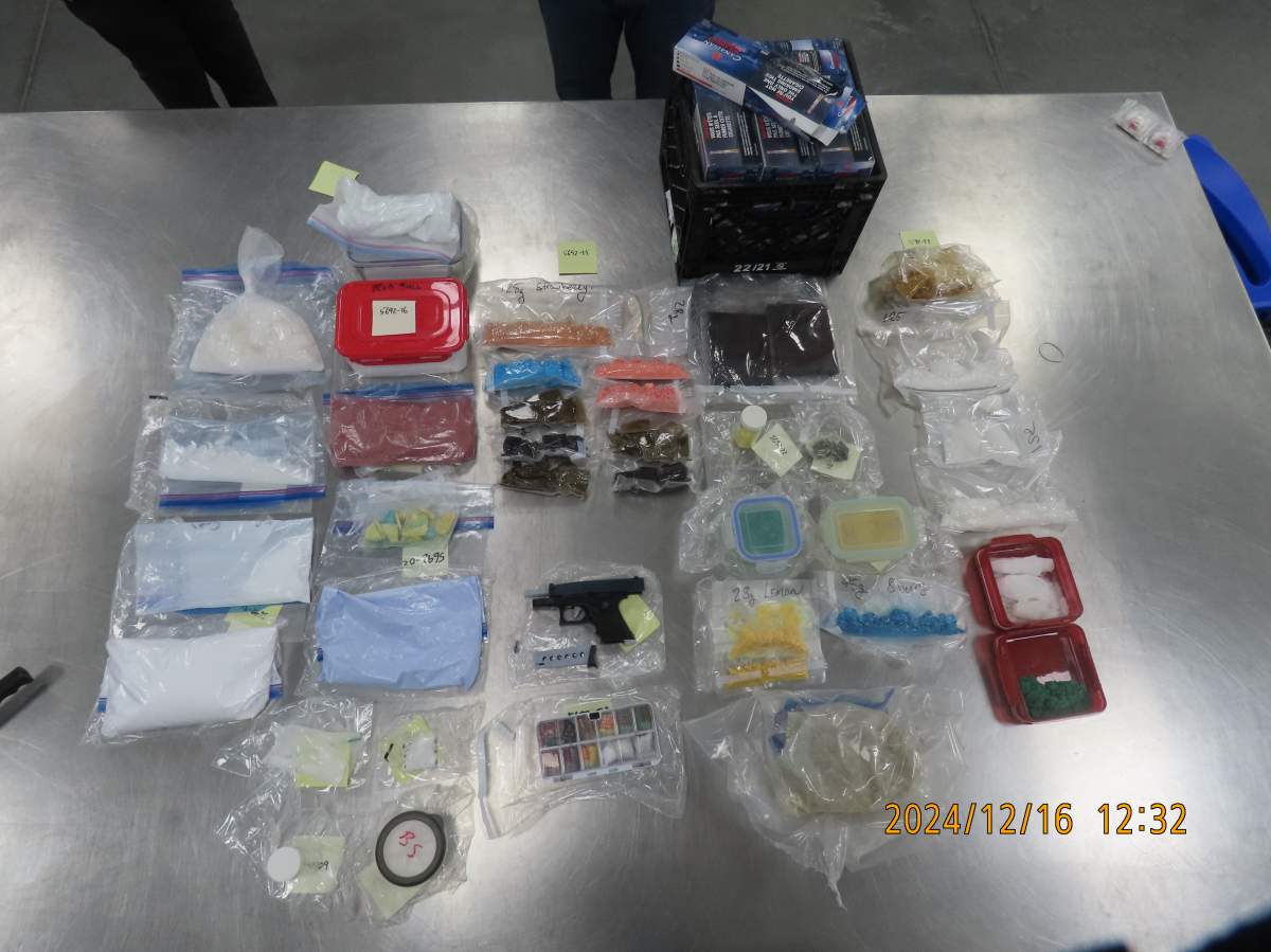 Calgary police say four people face a total of 17 charges after investigators executed search warrants on a suspected fentanyl production facility in downtown Calgary.