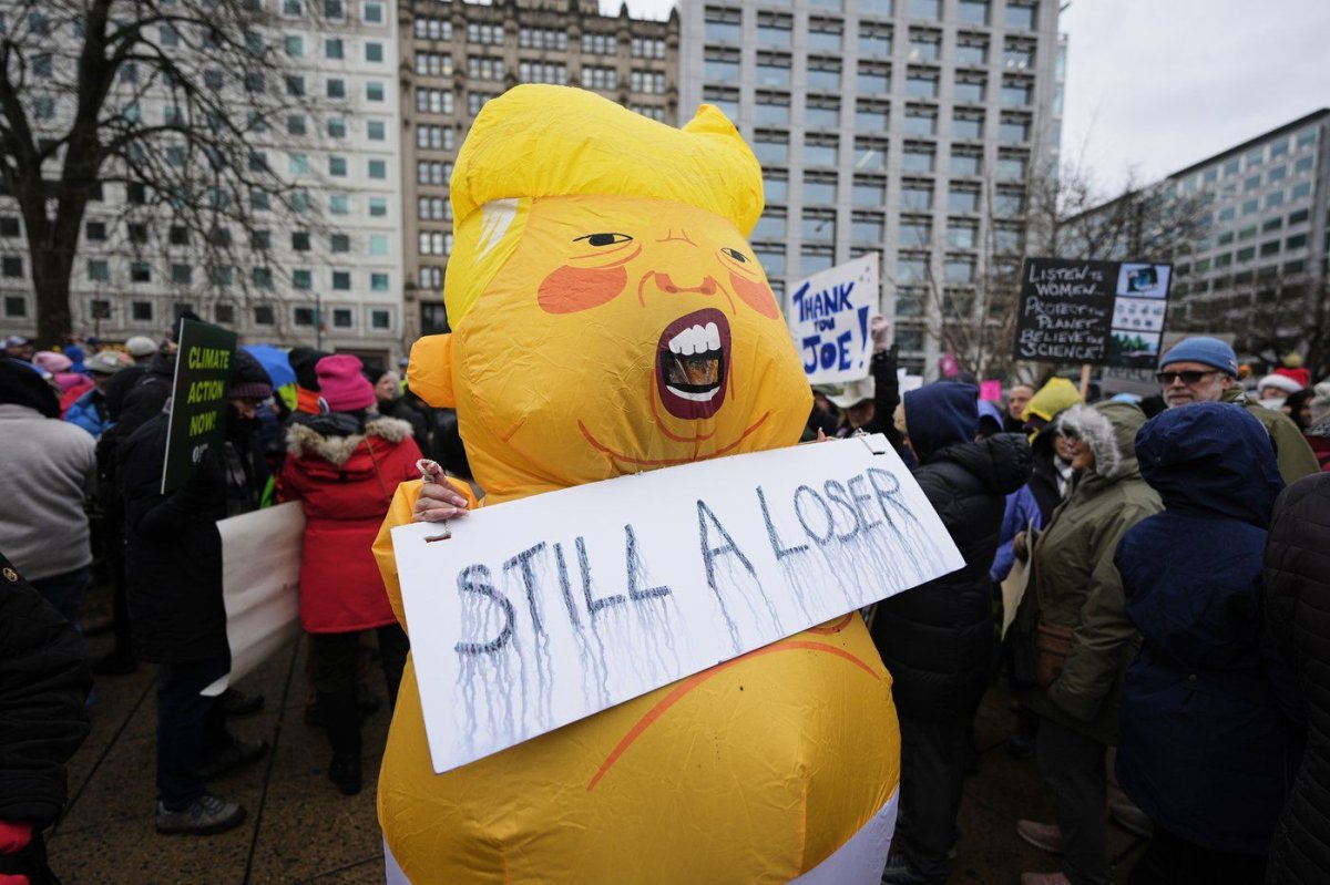 A person wears a costume in Farragut Square before the start of the People's March, Saturday, Jan. 18, 2025, in Washington. (AP Photo/Mike Stewart) Mike Stewart