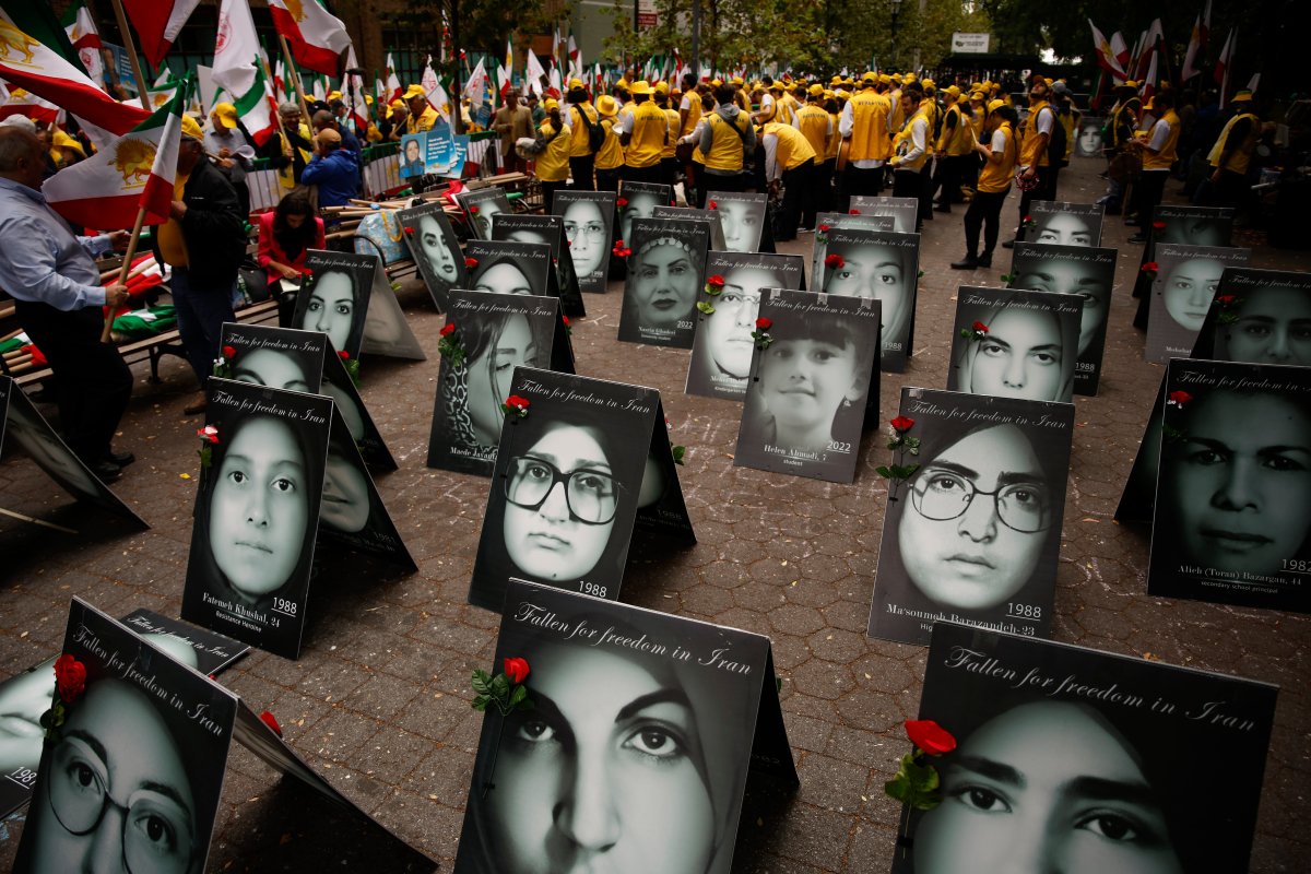 Demonstrators outside United Nations headquarters amidst portraits of women executed by the Iranian regime, Sept. 24, 2024, in New York. (AP Photo/Stefan Jeremiah)