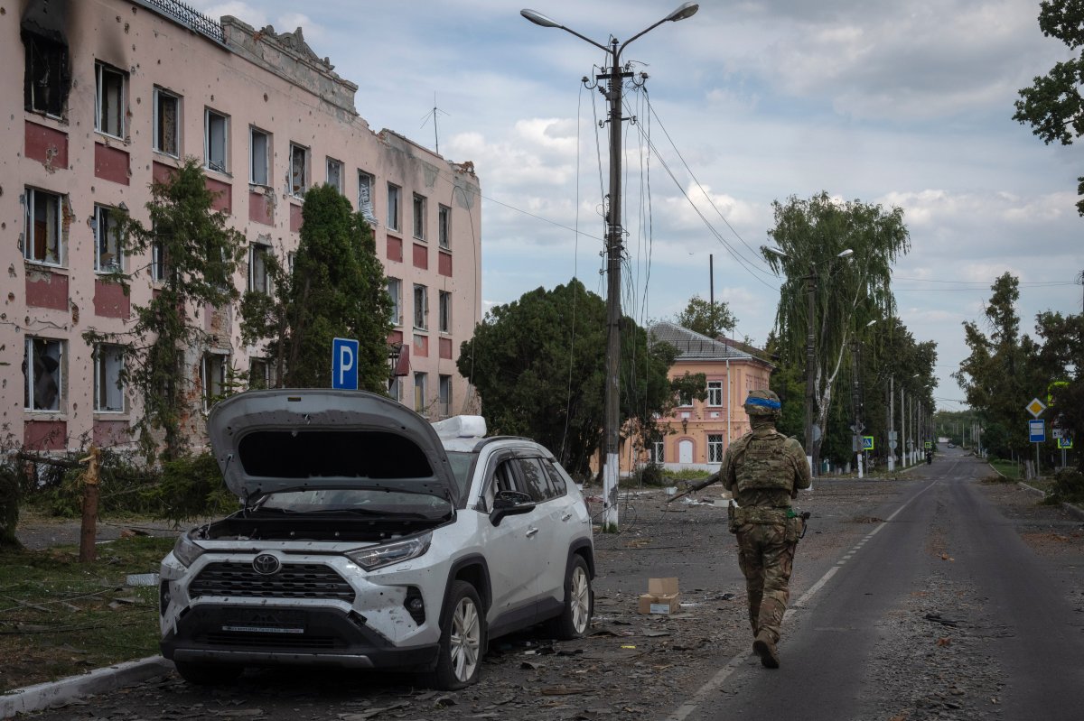 A Ukrainian soldier walks past a building in Sudzha, Kursk region, Russia, on Aug. 16, 2024. This image was approved by the Ukrainian Defense Ministry before publication. (AP Photo, File)