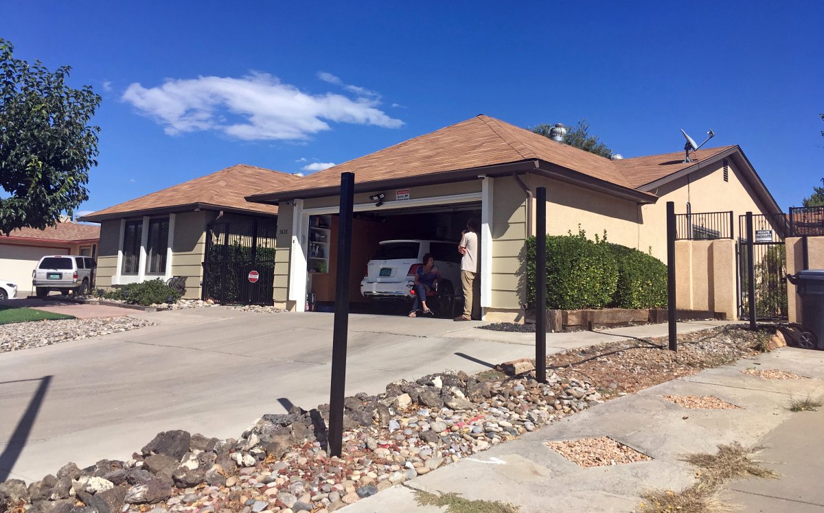 Poles for a new fence stand outside the house used in the AMC-TV series “Breaking Bad” in Albuquerque, N.M., on Friday, Oct. 13, 2017.